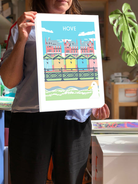 Hove Art Print, artist hold unframed print, by Red Faces Prints